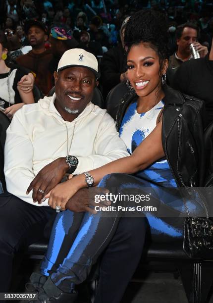 Simon Guobadia and Porsha Williams attend the game between the Brooklyn Nets and the Atlanta Hawks at State Farm Arena on December 06, 2023 in...