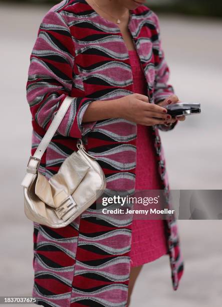 Aisha DeMorsella seen wearing gold necklace, pink tweed short dress, pink / black pattern velvet fabric short coat, Fendi Baguette gold metallic...