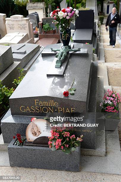 Picture taken on October 9, 2013 shows the grave of French singer Edith Piaf at the Pere Lachaise cemetery in Paris, on the eve of commemorating the...