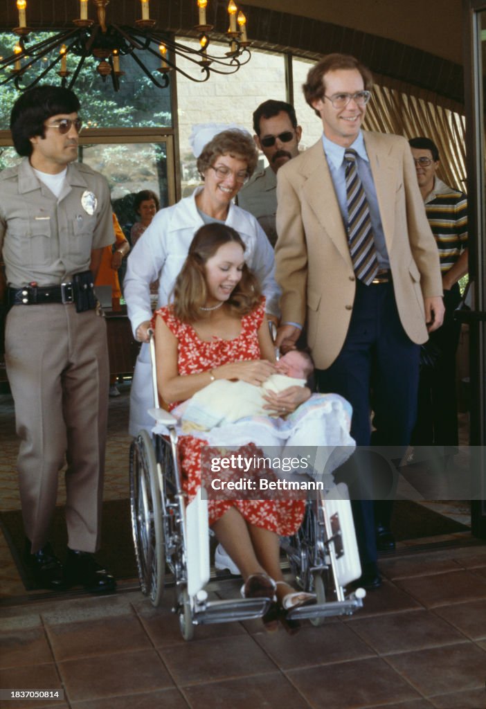 Julie Nixon Eisenhower, husband David Eisenhower and their newborn