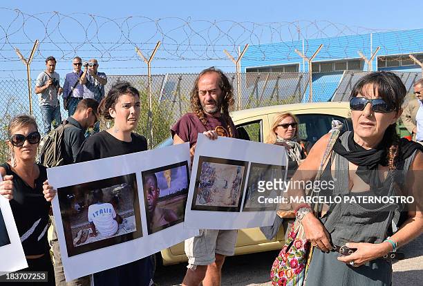 Residents of the southern Italian island of Lampedusa protest on October 9, 2013 against the visit of European Commission chief Jose Manuel Barroso...