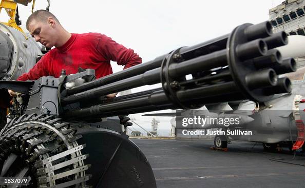 Ao2 Navy U.S. Navy AO2 Aaron Harris of Las Vegas, Nevada cleans the M61A1 ...