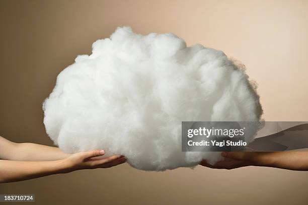 hands of men and women and cloud - fragility stock pictures, royalty-free photos & images