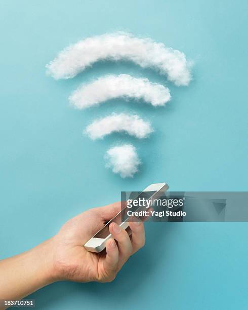 wi-fi and smartphone - wireless technology stock pictures, royalty-free photos & images