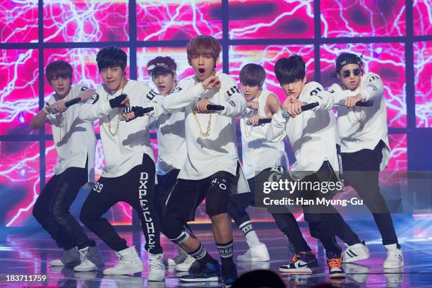 Members of South Korean boy band BTS perform onstage the MBC Music 'Show Champion' at Uniqlo AX-Hall on October 09, 2013 in Seoul, South Korea.