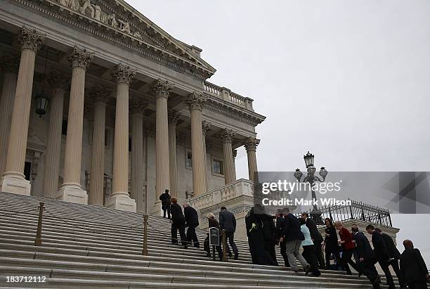 Senate Democrats walk up the Senate steps after a news conference on the government shutdown at the U.S. Capitol, October 9, 2013 in Washington, DC....