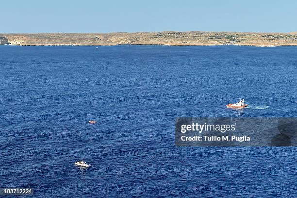 Images taken from a AB412 helicopter with the Second Regiment SIRIO of the Italian Army show Coast Guard units taking part in a search and rescue...