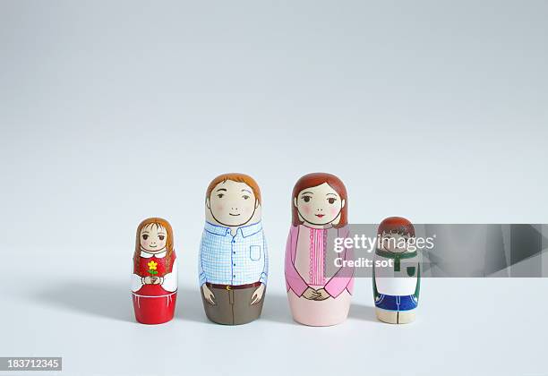 a set of matryoshka dolls of family - männliche figur stock-fotos und bilder