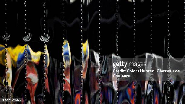 riveted aluminum surface on which colored lights are reflected and distorted in manhattan, new york state, united states - billboard truck stock-fotos und bilder