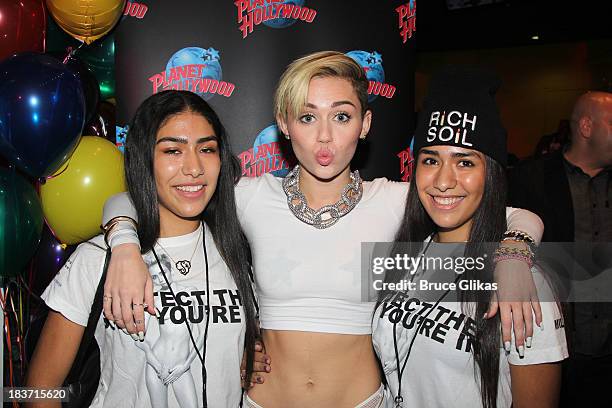 Miley Cyrus attends the Miley Cyrus "Bangerz" Record Release Signing at Planet Hollywood Times Square on October 8, 2013 in New York City.