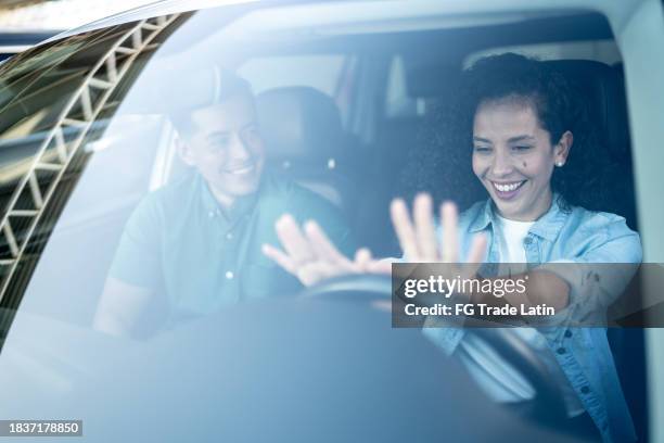 mid adult couple with their new car at dealership - test drive stock pictures, royalty-free photos & images
