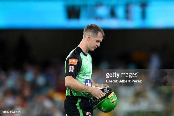 Sam Harper of the Stars leaves the field after being dismissed during the BBL match between Brisbane Heat and Melbourne Stars at The Gabba, on...