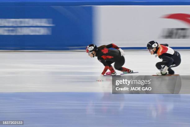 Canada's Danae Blais and Netherlands' Xandra Velodrome compete in the Final A of the women's 3000m relay at the ISU World Cup Short Track Speed...