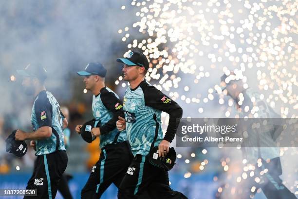 The Brisbane Heat take to the field during the BBL match between Brisbane Heat and Melbourne Stars at The Gabba, on December 07 in Brisbane,...