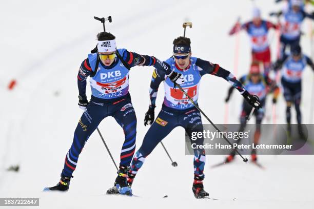 Erik Perrot of France and Sturla Holm Laegreid of Norway competes during the Men 4x7.5 km Relay at the BMW IBU World Cup Biathlon Hochfilzen on...