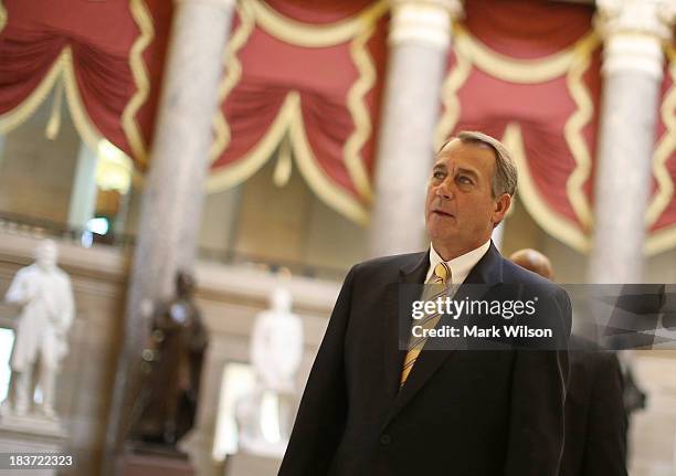 House Speaker John Boehner walks through Statuary Hall at the U.S. Capitol, October 9, 2013 in Washington, DC. The U.S. Government shutdown is...