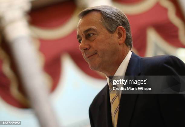 House Speaker John Boehner walks through Statuary Hall at the U.S. Capitol, October 9, 2013 in Washington, DC. The U.S. Government shutdown is...