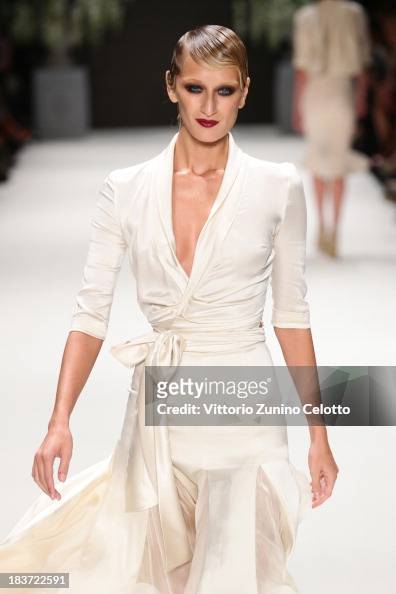 Model Didem Soydan walks the runway at the Tuvanam show during... News ...