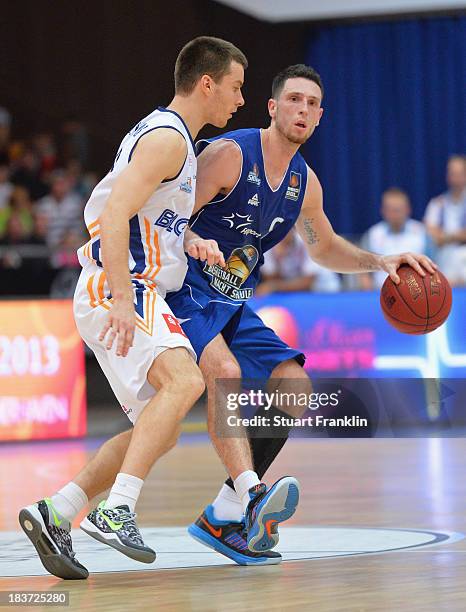 Tim Oldenburg of Frankfurt challenges for the ball with Philip Zwiener of Bremerhaven during the BEKO Bundesliga basketball game between Eisbaeren...