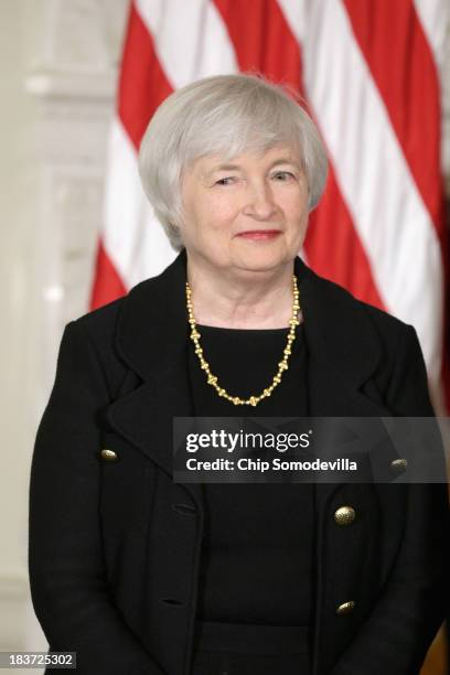 Janet Yellen listens as U.S. President Barack Obama speaks during a press conference to nominate her to head the Federal Reserve in the State Dining...