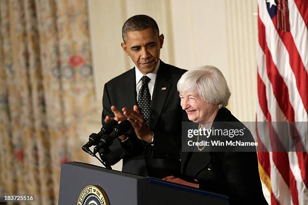 President Barack Obama claps during a press conference to nominate Janet Yellen to head the Federal Reserve in the State Dining Room at the White...