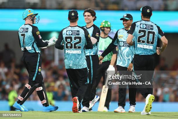 Mitch Swepson of the Heat celebrates after dismissing Joe Burns of the Stars during the BBL match between Brisbane Heat and Melbourne Stars at The...