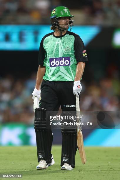 Joe Burns of the Stars leaves the field after being dismissed during the BBL match between Brisbane Heat and Melbourne Stars at The Gabba, on...