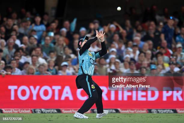 Max Bryant of the Heat catches out Liam Dawson of the Stars during the BBL match between Brisbane Heat and Melbourne Stars at The Gabba, on December...