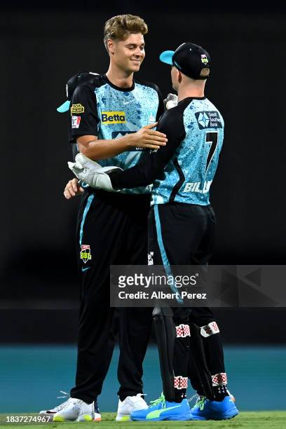 Spencer Johnson of the Heat celebrates with team mates after dismissing Liam Dawson of the Stars during the BBL match between Brisbane Heat and...