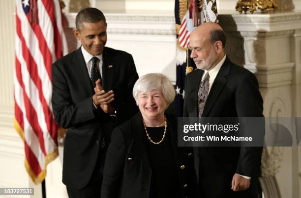 Janet Yellen smiles as U.S. President Barack Obama and current Chairman of the Federal Reserve Ben Bernake applaude her during a press conference to...