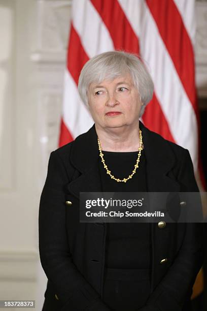 Janet Yellen listens as U.S. President Barack Obama speaks during a press conference to nominate her to head the Federal Reserve in the State Dining...