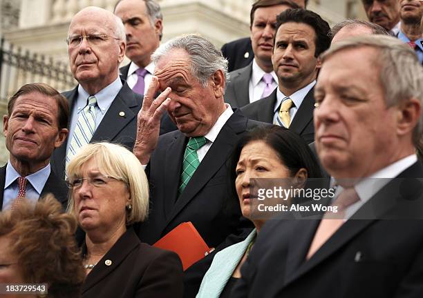 Sen. Tom Harkin pauses during a rally with members of the Senate Democratic Caucus at the Senate steps October 9, 2013 on Capitol Hill in Washington,...