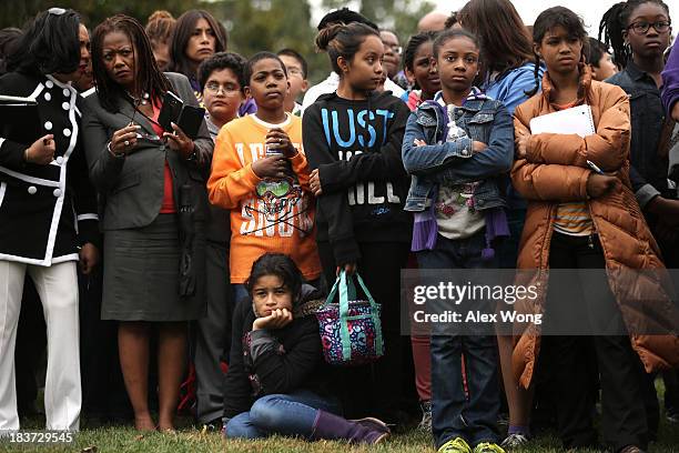 Sixth-grader Kelsy Contreras Flores, lower center, of Elsie Whitlow Stokes Community Freedom Public Charter School in Washington, DC and her...