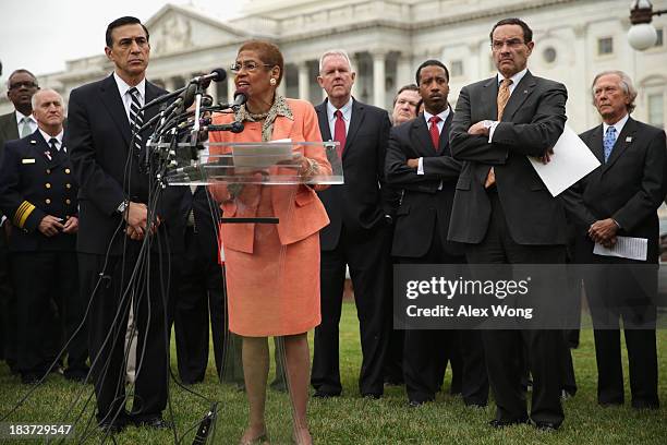 Delegate Eleanor Holmes Norton speaks as Rep. Darrell Issa and Washington, DC Mayor Vincent Gray listen during a news conference with members of the...