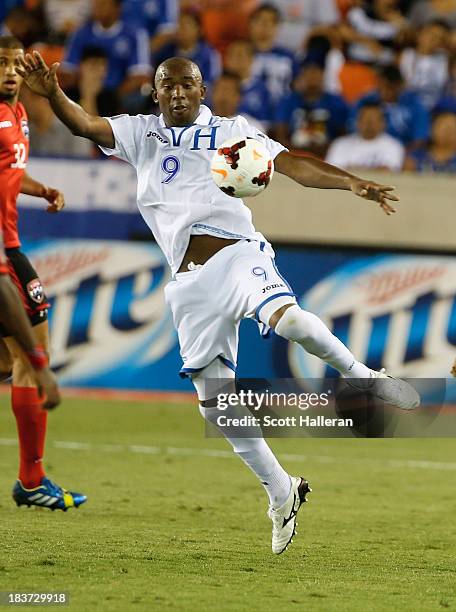 Jerry Palacios of Honduras controls the ball as Kevin Molino of Trinidad & Tobago looks on during the CONCACAF Gold Cup game at BBVA Compass Stadium...