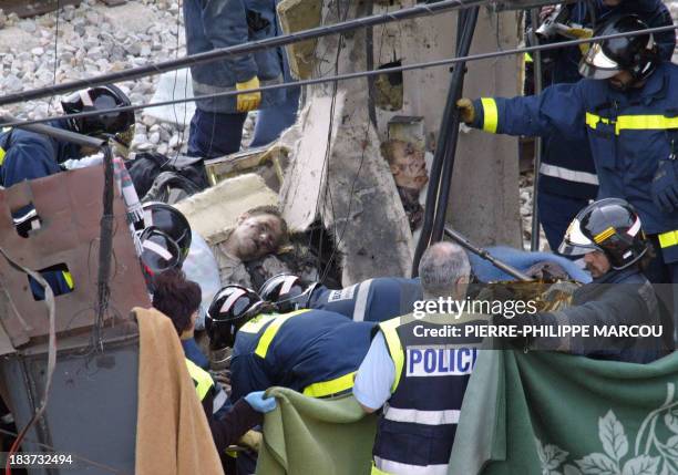 Policemen intervene after a train exploded at the Atocha train station in Madrid 11 March 2004. 200 people were killed and more than 1400 wounded in...