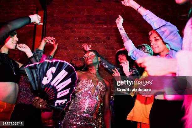 diverse group of lgbtqia friends celebrating at a party - gay nightclub stock pictures, royalty-free photos & images