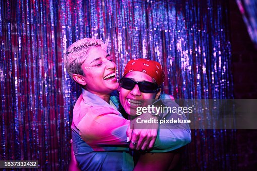Two LGBTQIA Friends Celebrating at a Party Two LGBTQIA Friends Celebrating at a Party