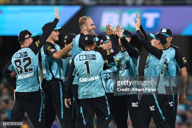 Paul Walter of the Heat celebrates with team mates during the BBL match between Brisbane Heat and Melbourne Stars at The Gabba, on December 07 in...