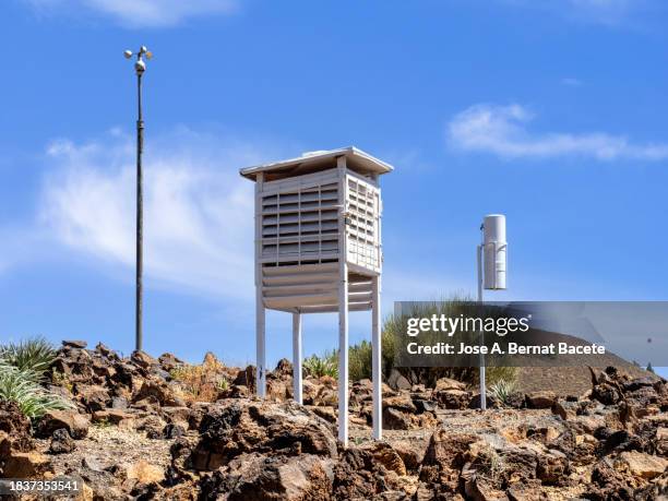 weather station in the field on a sunny blue sky day. - weather station stock pictures, royalty-free photos & images