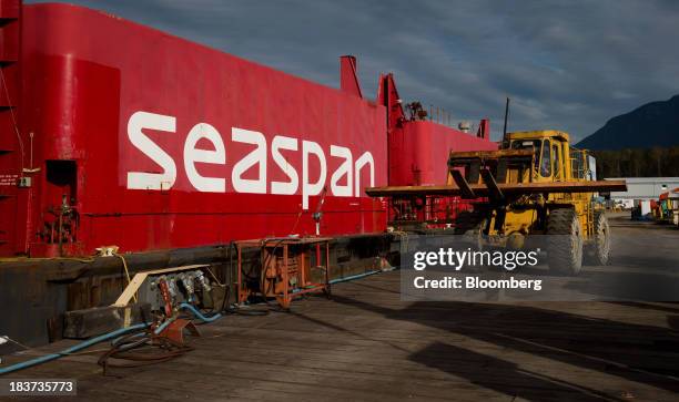 Worker uses a forklift while repairing a dock at the Seaspan Vancouver Shipyard in North Vancouver, British Columbia, Canada, on Wednesday, Oct. 9,...