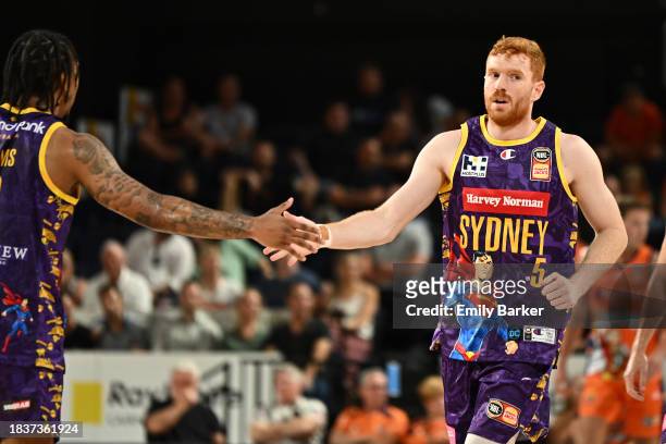 Angus Glover of the Kings is congratulated by teammate Jaylen Adams during the round 10 NBL match between Cairns Taipans and Sydney Kings at Cairns...