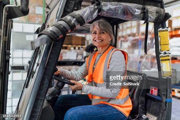 trained forklift driver in the work place - industrial plant stock pictures, royalty-free photos & images