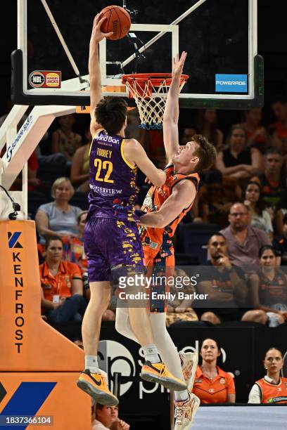 Alex Toohey of the Kings goes to the basket under pressure from Sam Waardenburg of the Taipans during the round 10 NBL match between Cairns Taipans...