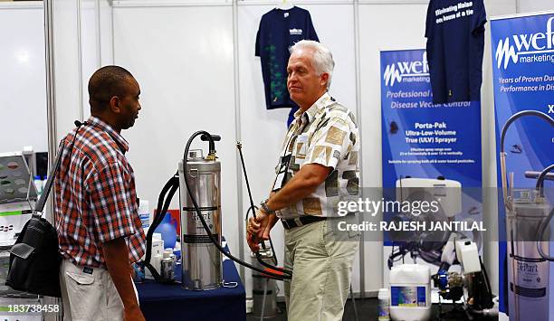 Manuel Lluberas from HD Hudson Manufacturing Company gives a chemical sprayer demonstration to a conference delegate during the 6th MIM Pan-African...