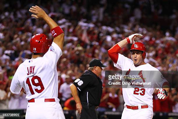 David Freese of the St. Louis Cardinals celebrates his two-run home run scoring Jon Jay of the St. Louis Cardinals in the second inning against the...