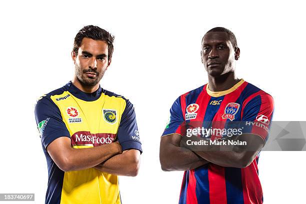 Marcos Flores of Central Coast Mariners and Emile Heskey of Newcastle Jets pose during the 2013/14 A-League Season Launch at Allianz Stadium on...