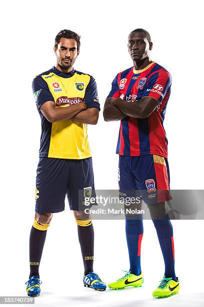 Marcos Flores of Central Coast Mariners and Emile Heskey of Newcastle Jets pose during the 2013/14 A-League Season Launch at Allianz Stadium on...