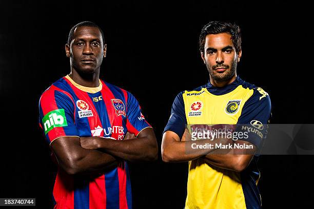 Marcos Flores of Central Coast Mariners and Emile Heskey of Newcastle Jets pose during the 2013/14 A-League Season Launch at Allianz Stadium on...