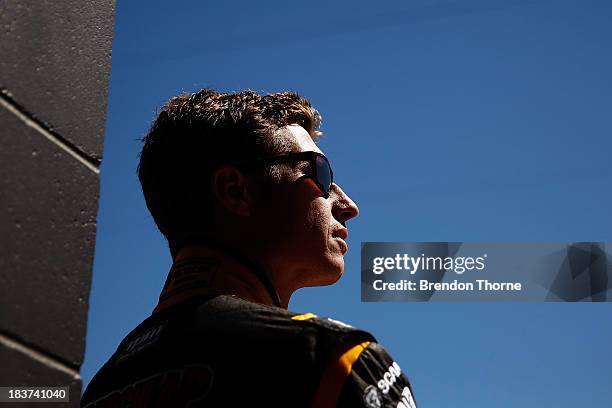 Ryan Briscoe driver of the Supercheap Auto Racing Holden watches from the pitlane during practice for the Bathurst 1000, which is round 11 of the V8...